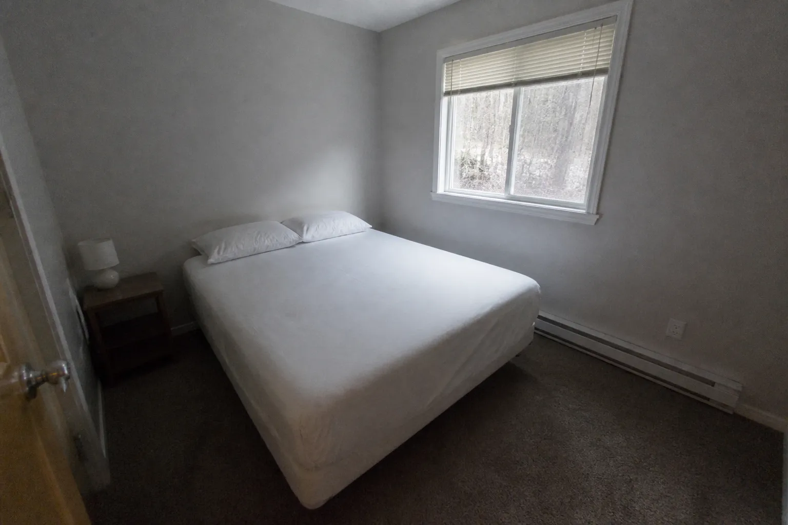 Guest bed remade after Airbnb turnover cleaning in Alaska
