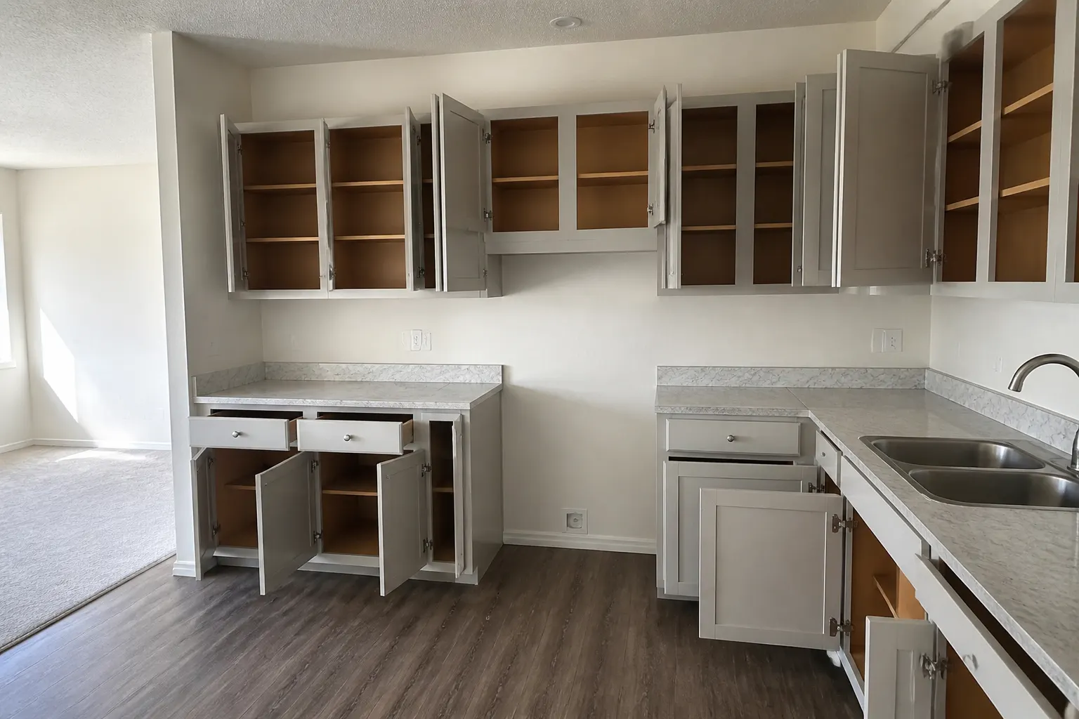 Empty kitchen cabinets after move-out cleaning in Anchorage